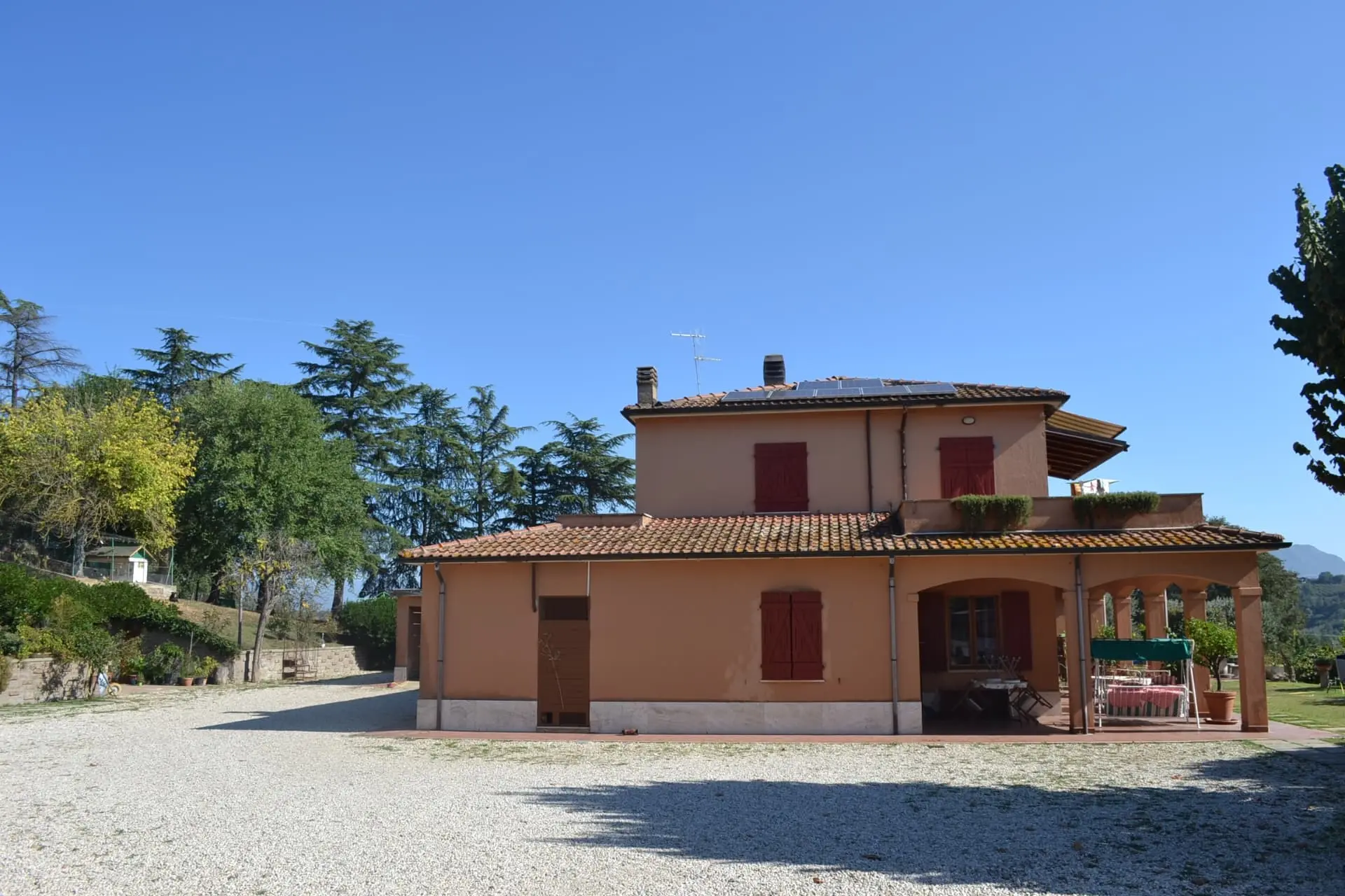 Il Casale - rustic stone farmhouse with red shutters and countryside views