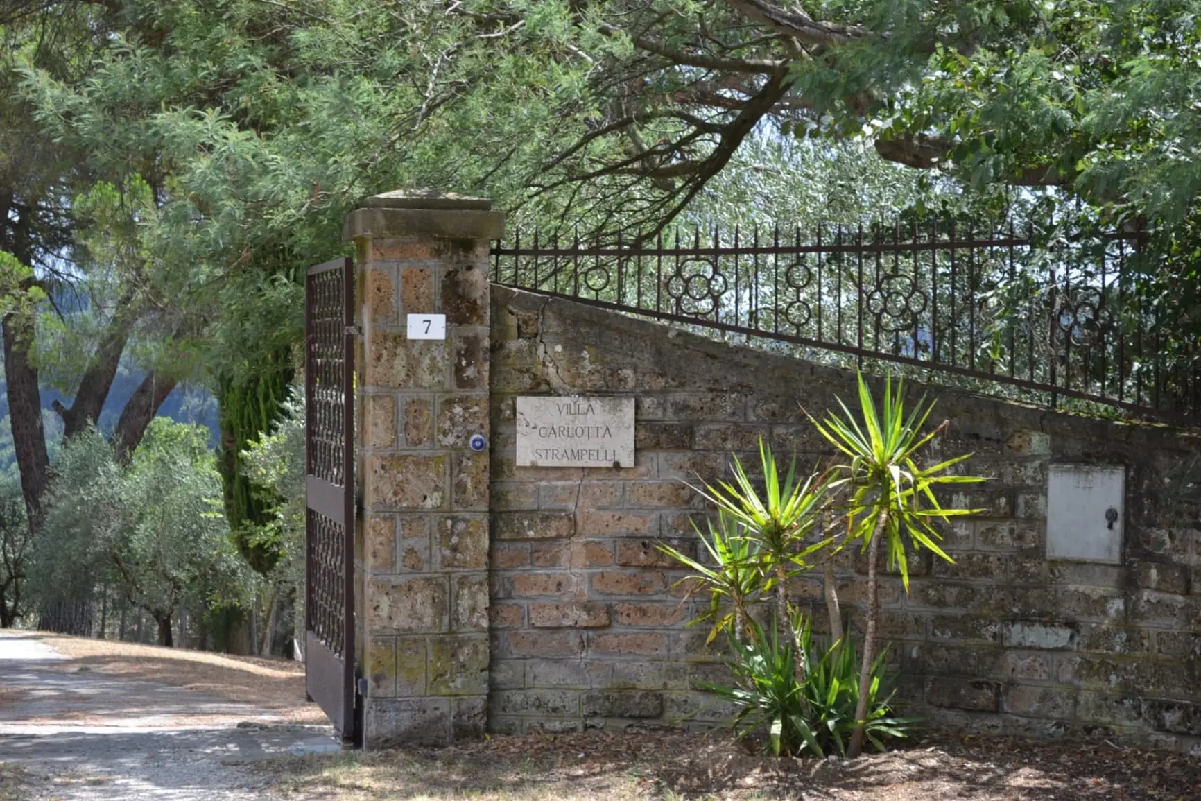 Villa Carlotta Strampelli entrance gate with traditional stonework