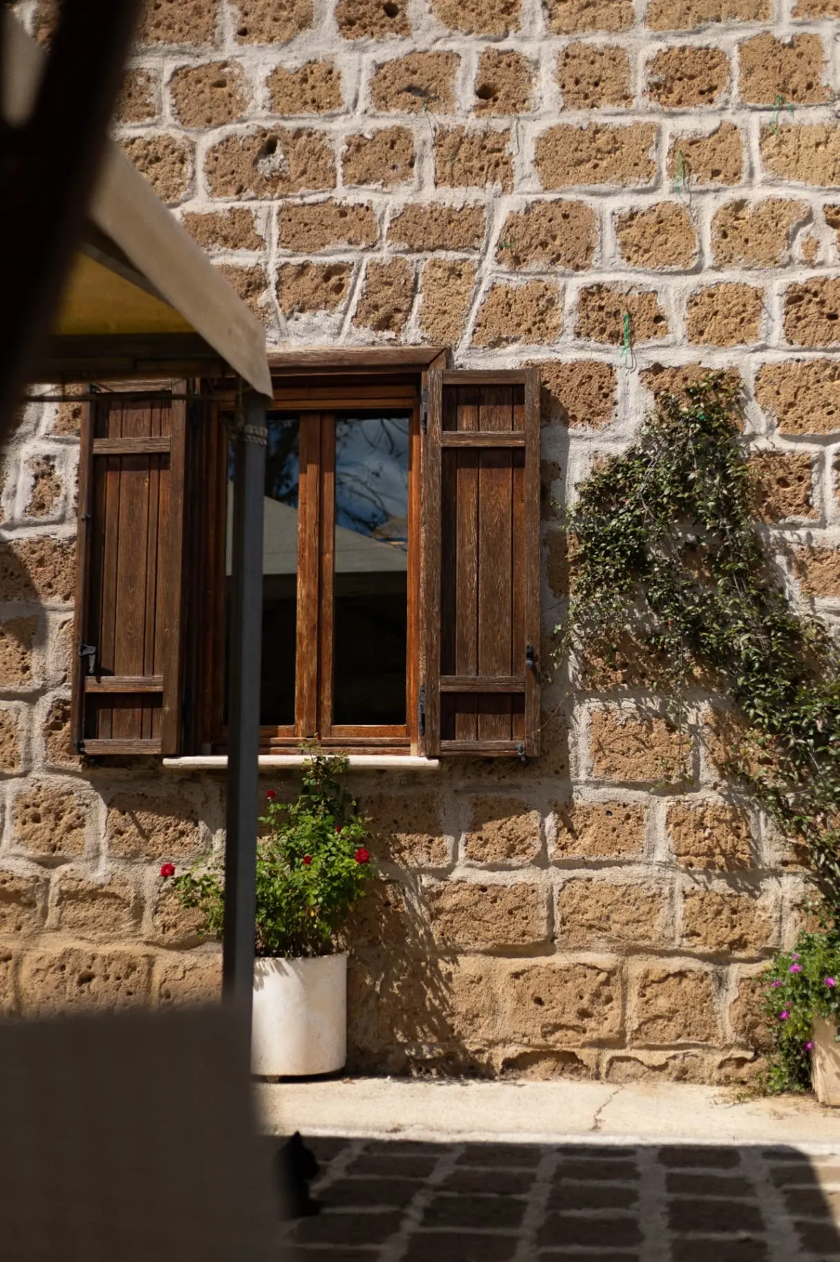 Casale exterior detail with wooden window