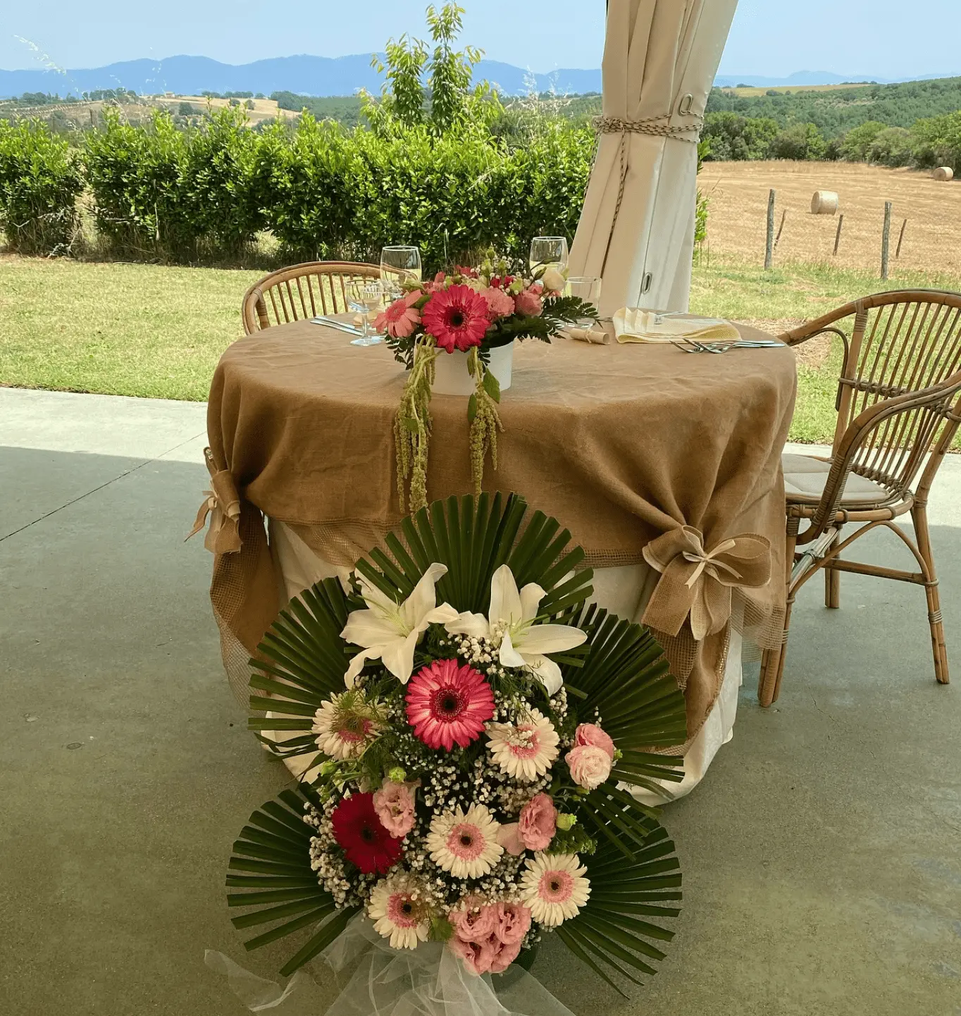 Romantic outdoor dining setup with countryside views