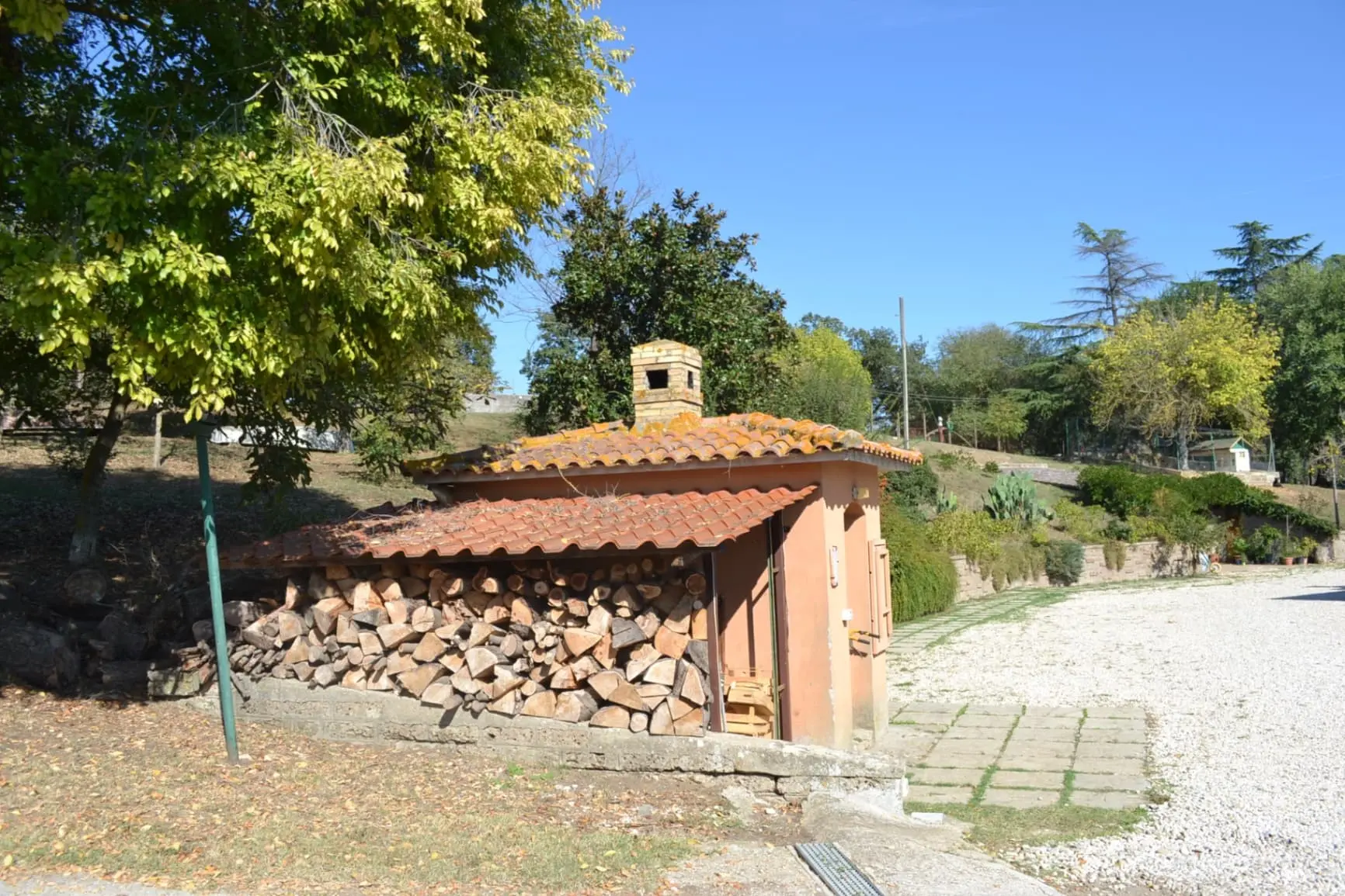 Traditional wood storage building with terracotta roof tiles